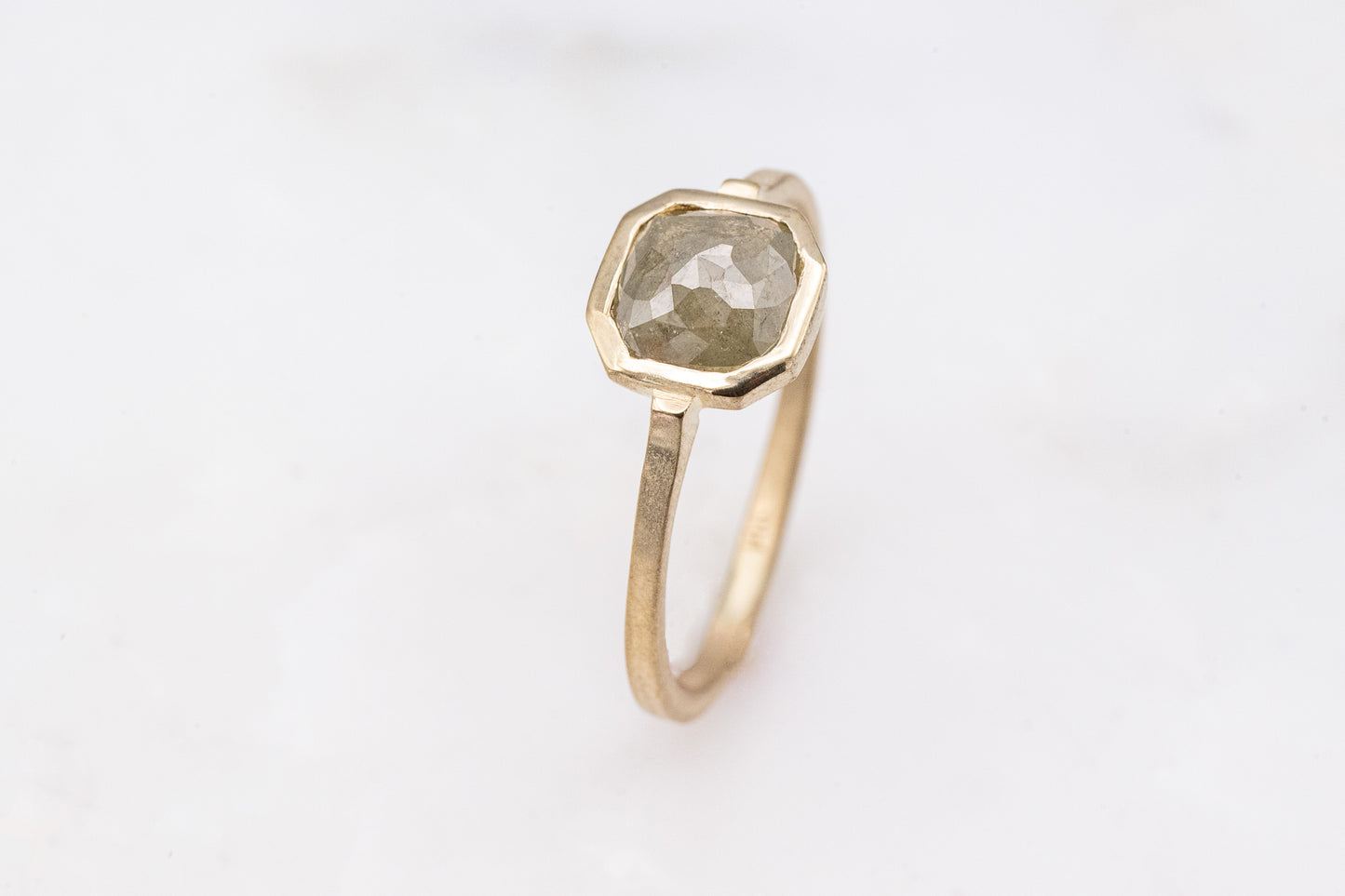 A Handmade Gray Diamond Ring in 14k Yellow Gold by Cassin Jewelry.