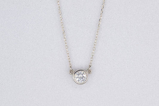 A handmade Moissanite Sterling Silver Necklace with a diamond focal point.