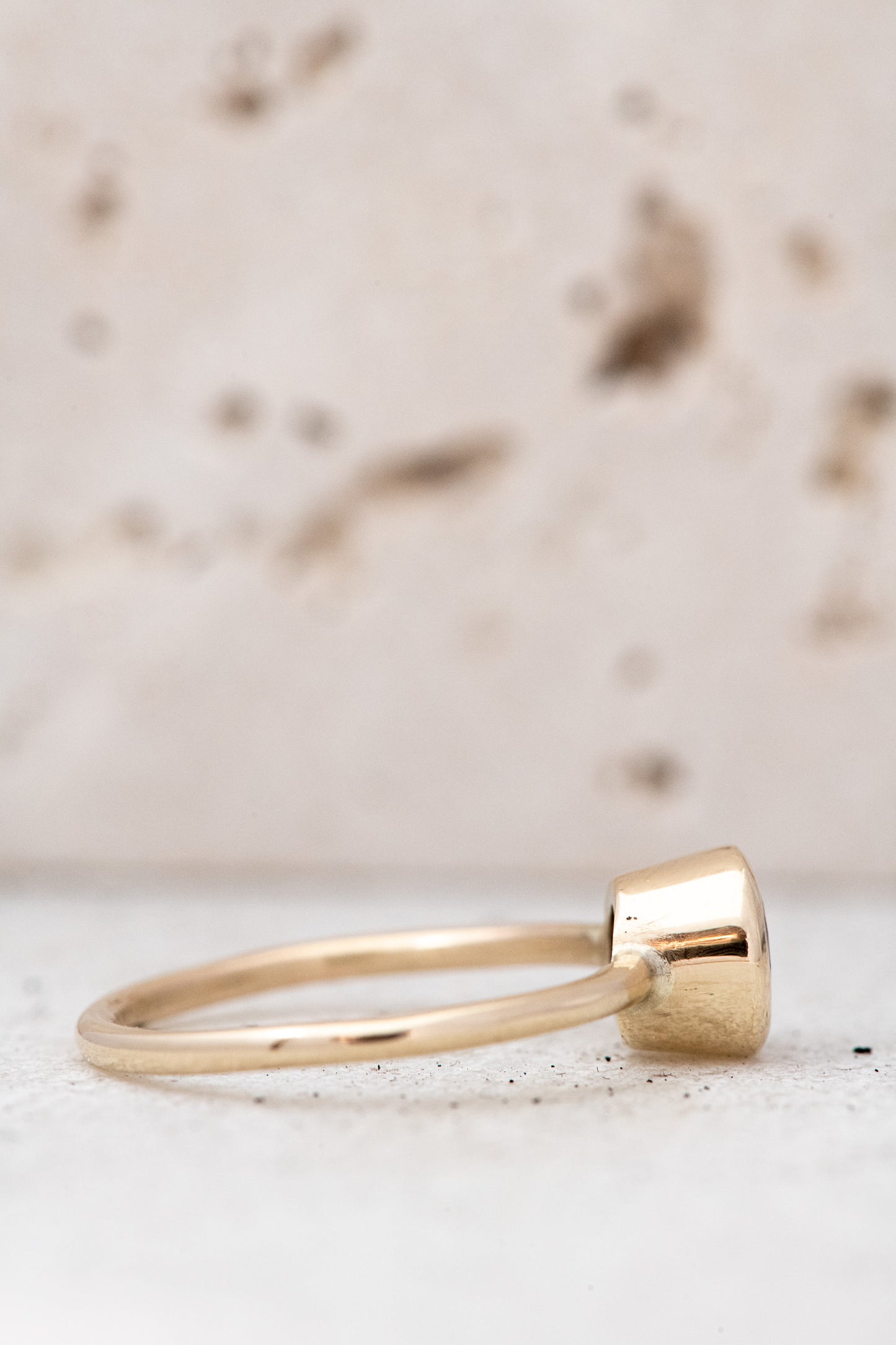 A handmade Tanzanite Solitaire Ring with a stone in the middle from Cassin Jewelry.