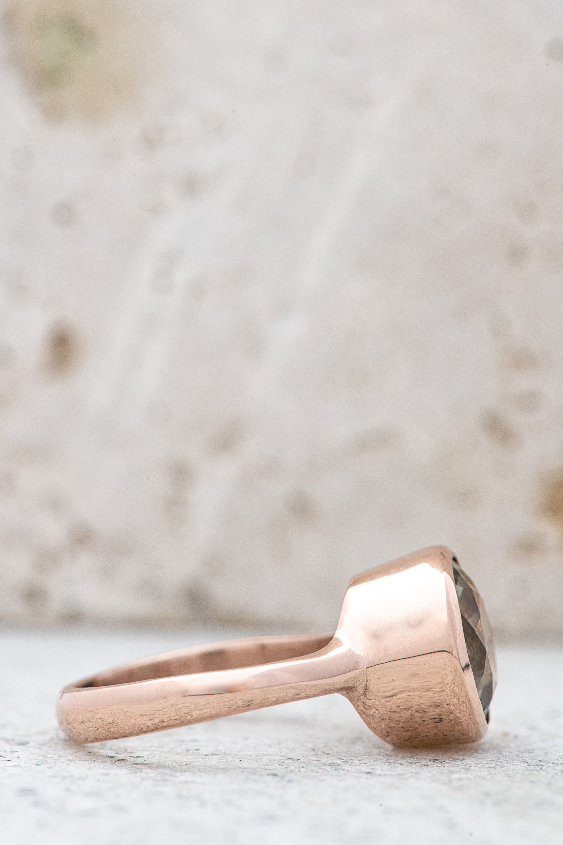 Handmade green amethyst and rose gold ring featuring a morganite stone.