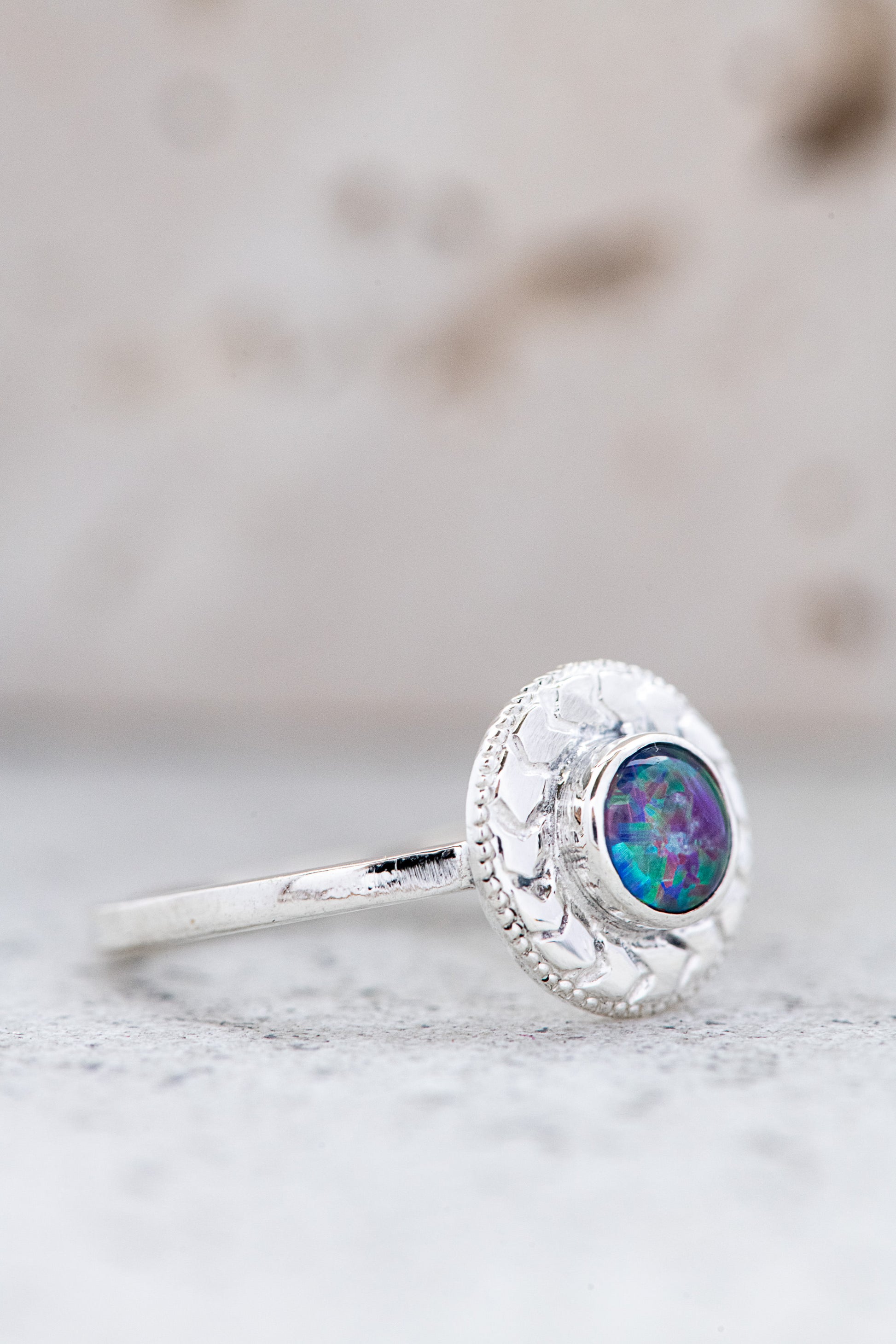 A handmade Australian Fire Opal Ring in 925 Sterling Silver with an opal stone.