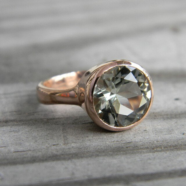 A handmade round green amethyst ring in rose gold by Cassin Jewelry.