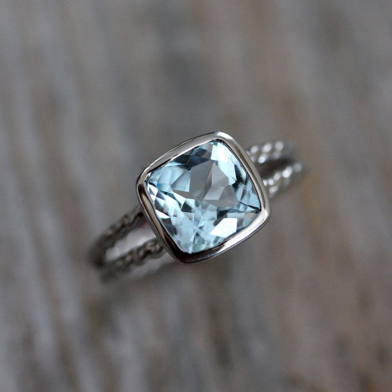 Cushion Cut Sky Blue Topaz Ring with a split shank rope band