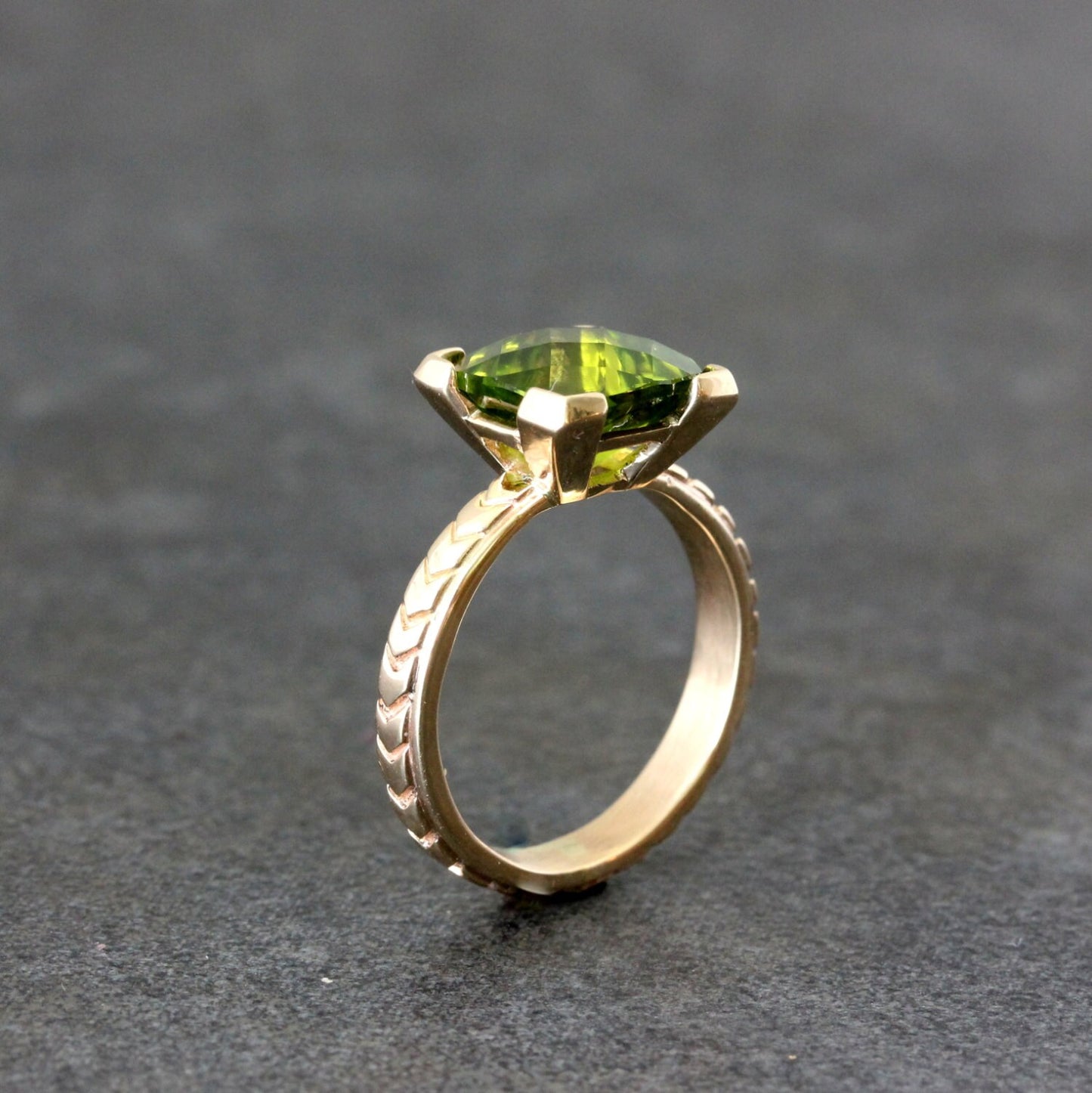 A Handmade Cushion Cut Peridot Yellow Gold Ring.