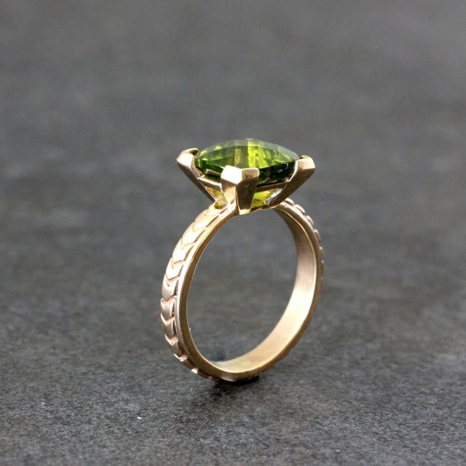 A Handmade Cushion Cut Peridot Yellow Gold Ring.