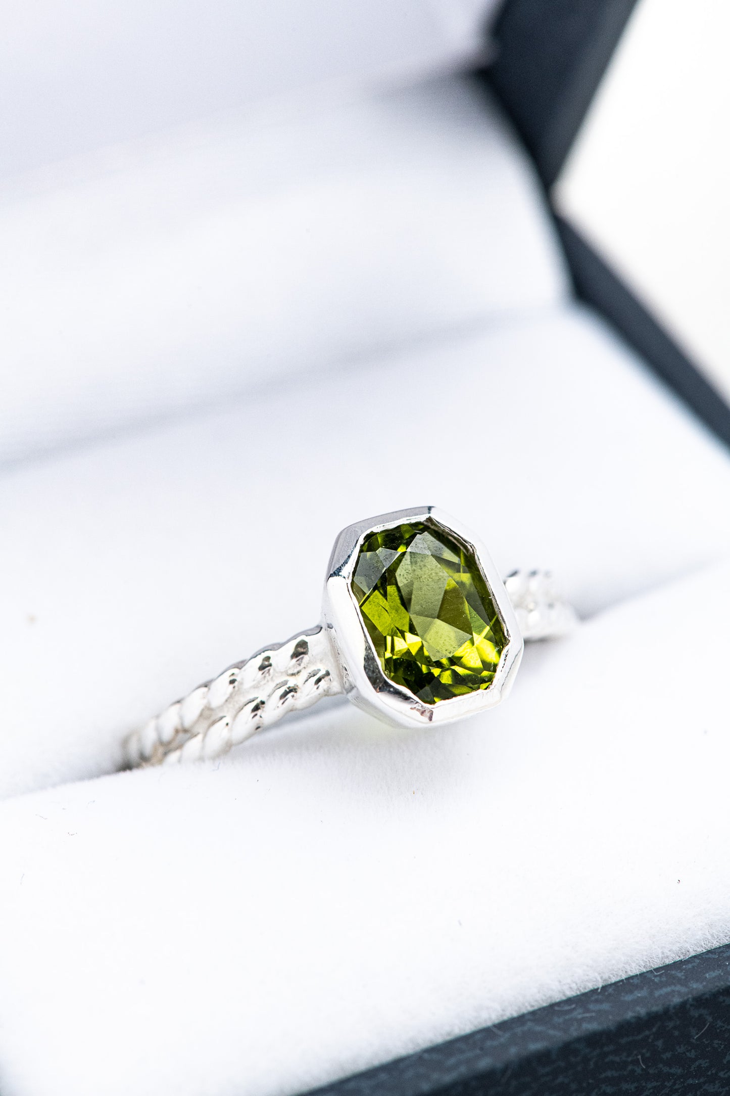 A Handmade Peridot Ring Size 7.5 in a box.