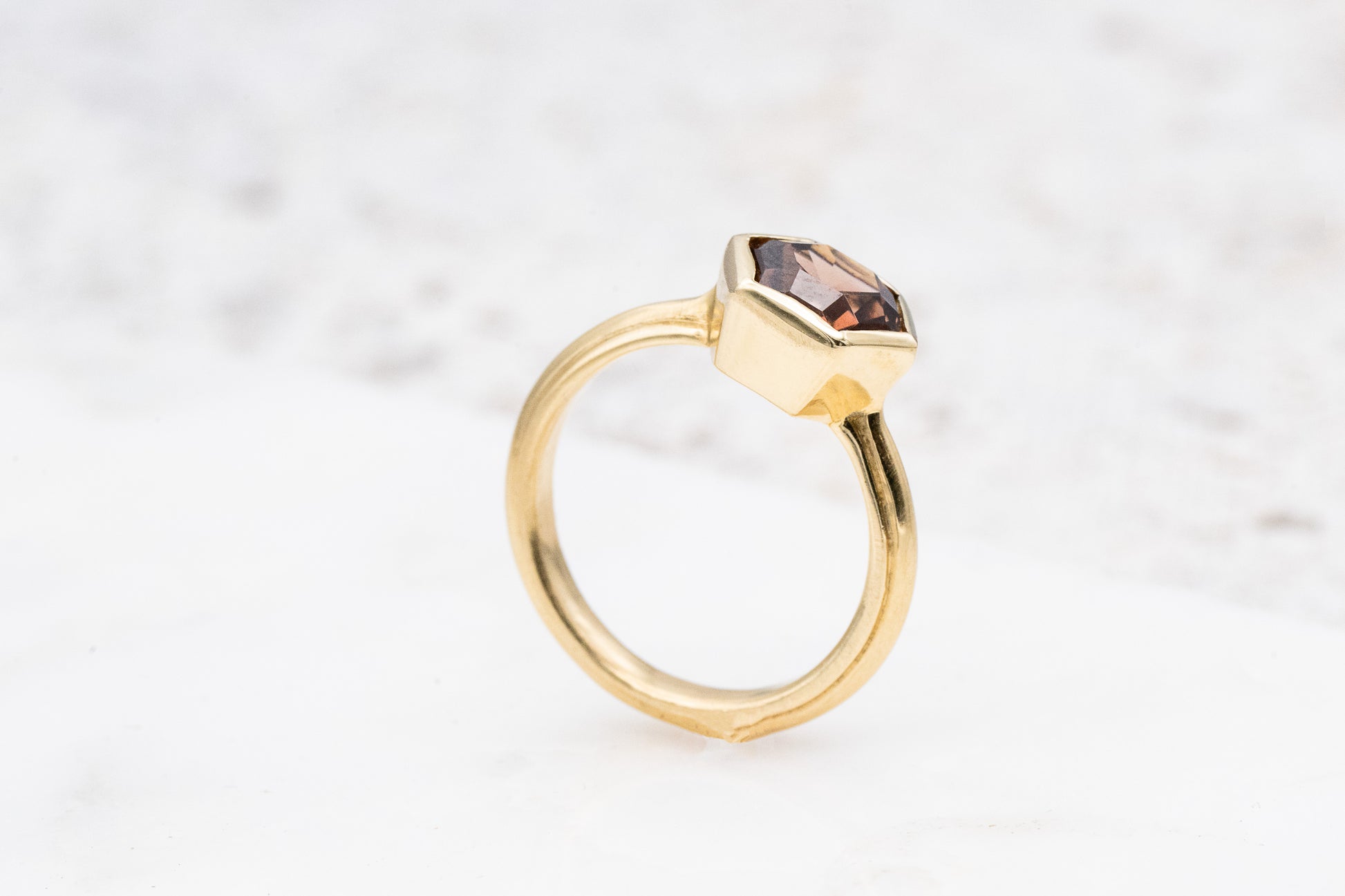 Cassin Jewelry offers a handmade Tawny Champagne Yellow Gold Hexagon ring with a brown stone.