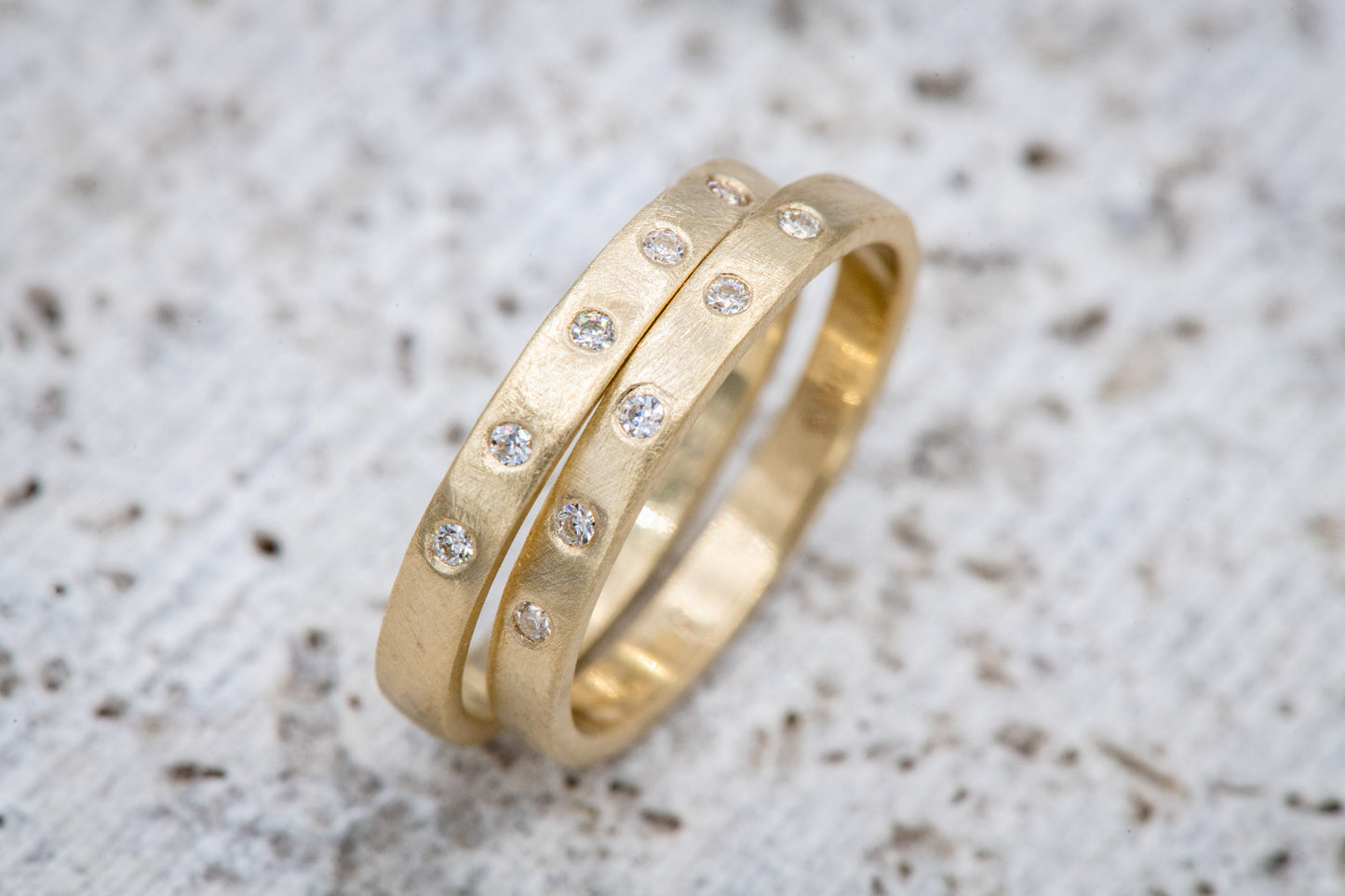Handmade Moissanite Gold Wedding Bands with diamonds by Cassin Jewelry.