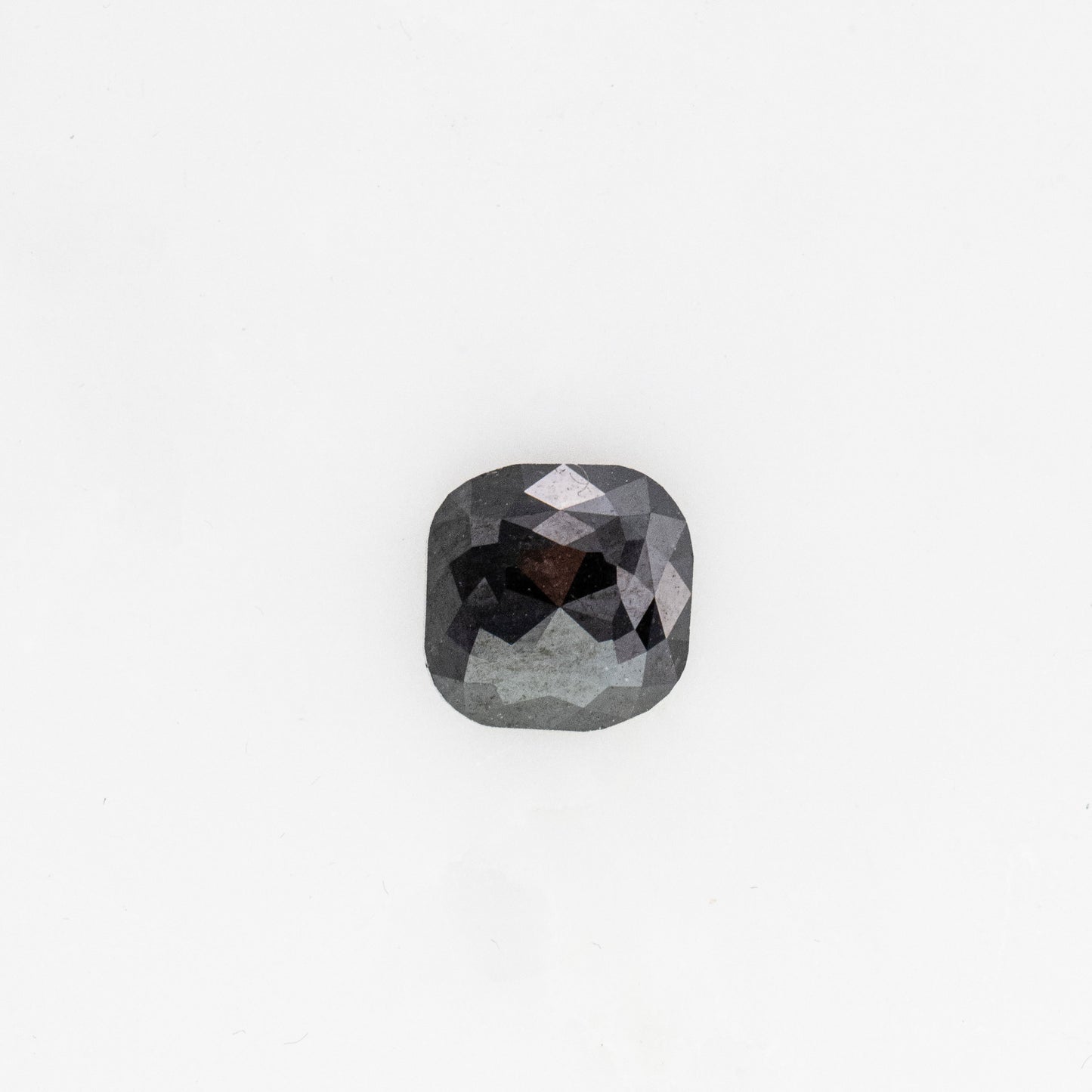 A handmade black rose cut diamond 7x7MM on a white background by Cassin Jewelry.