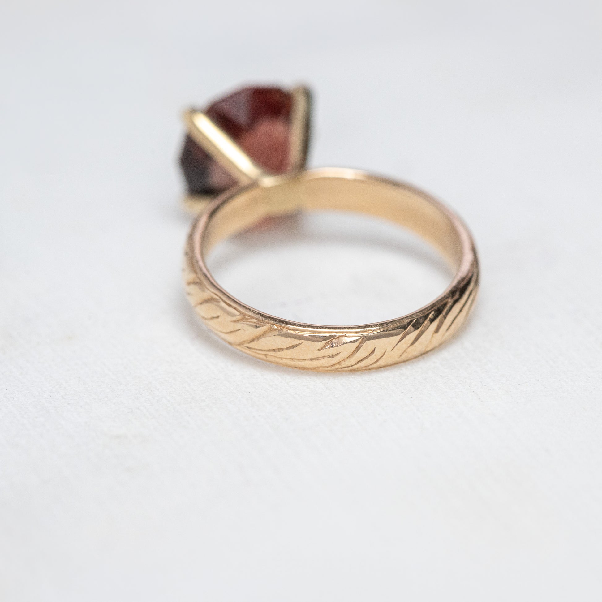 One of A Kind Custom Handcrafted Oregon Sunstone Ring in 14k Yellow Gold Size 7 with intricate detailing on the band, displayed on a white surface.