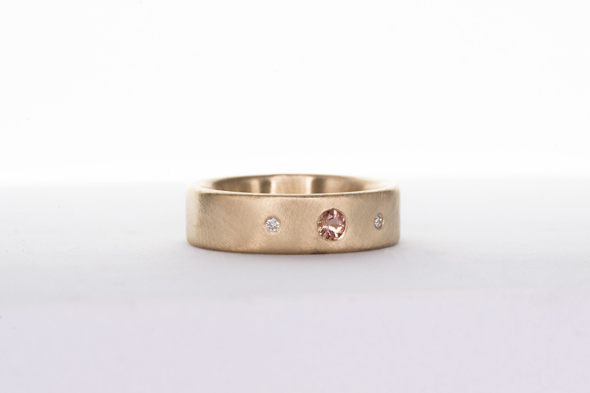 Handmade Oregon Sunstone and Diamond Wedding Ring designed by Cassin Jewelry.