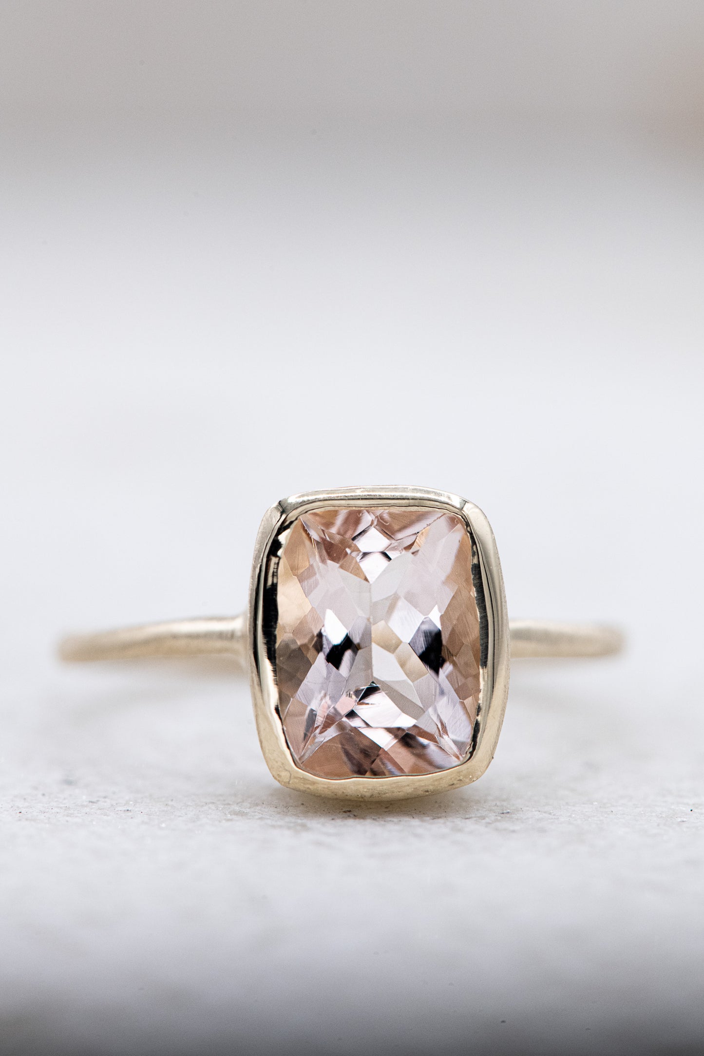 A handmade Yellow Gold and Morganite Ring with a cushion cut morganite from Cassin Jewelry.