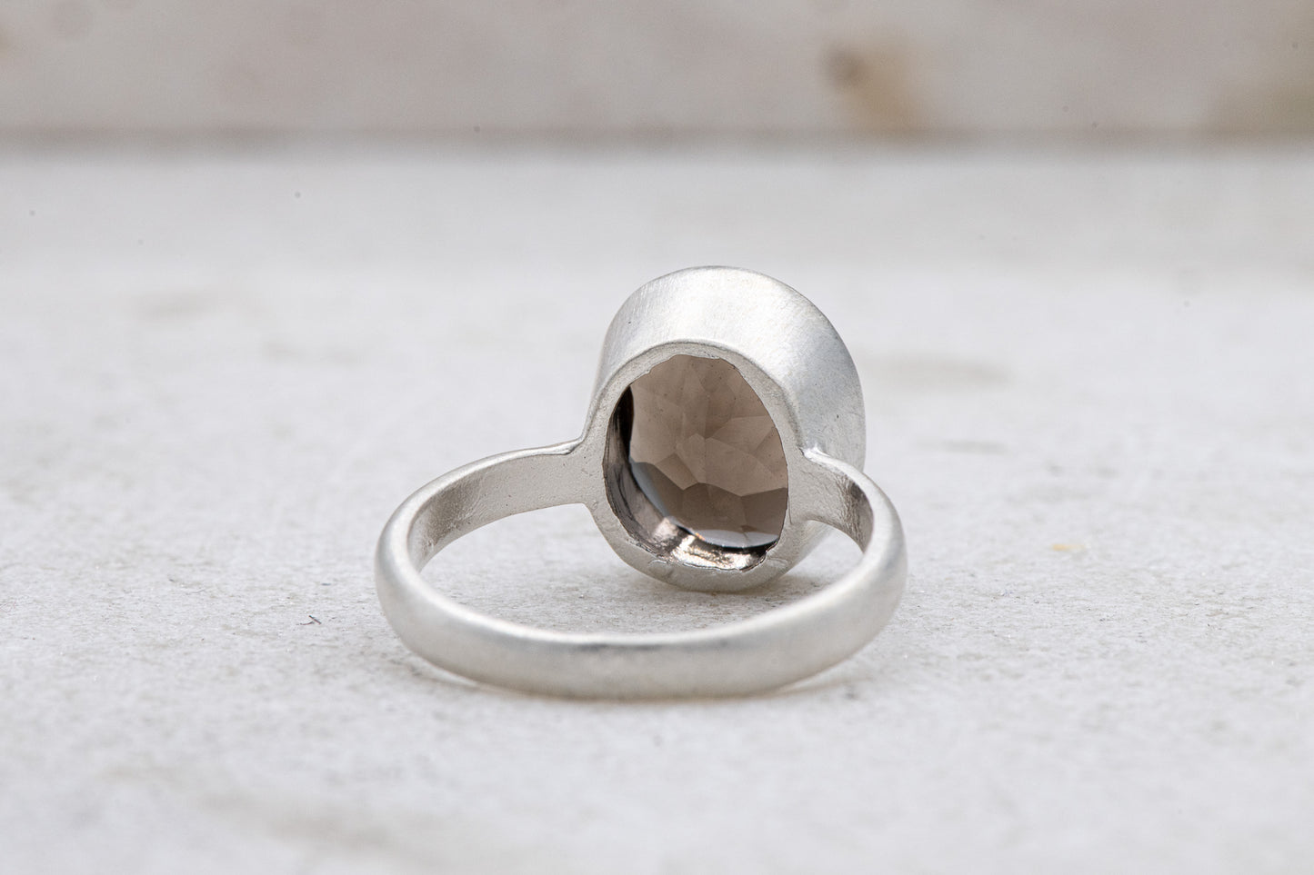 A handmade Solitaire Smoky Quartz Ring with a smoky quartz stone by Cassin Jewelry.