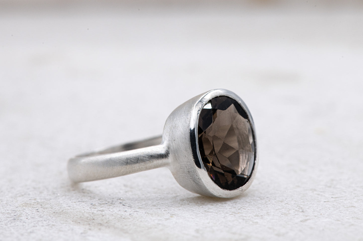 A handmade Solitaire Smoky Quartz Ring featuring a smoky quartz stone from Cassin Jewelry.