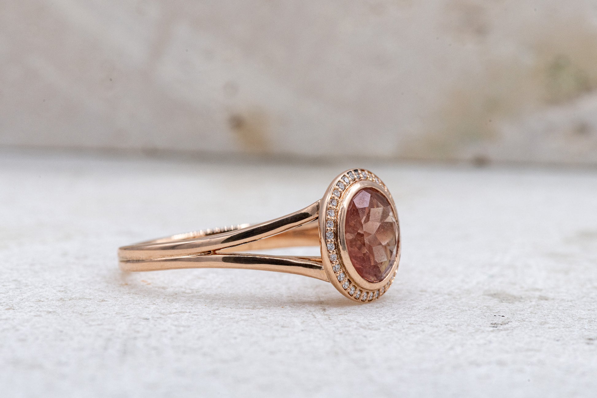 Cassin Jewelry presents a handmade Oregon Sunstone Diamond Halo Ring with a brown stone and diamonds.