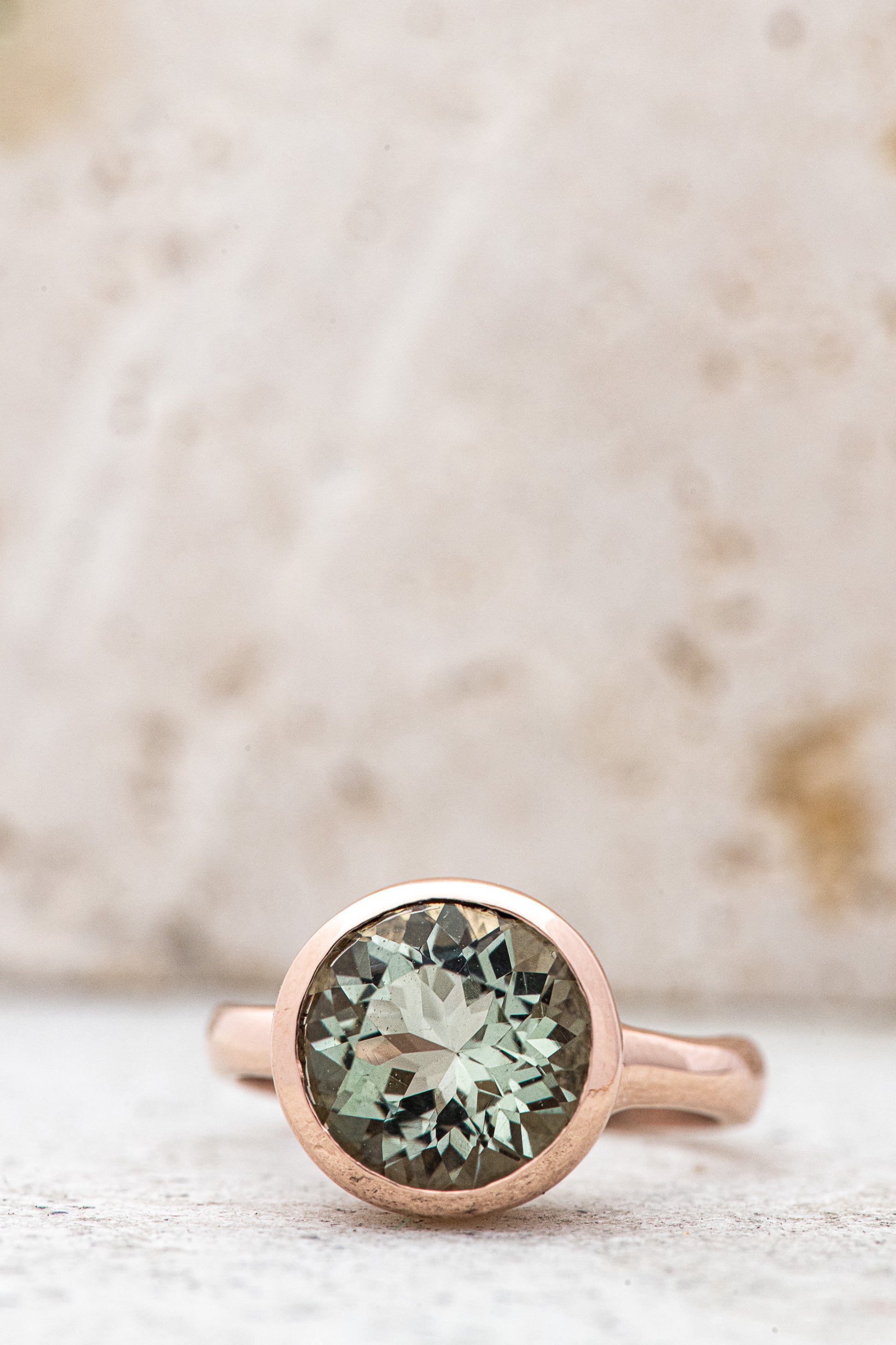 A Round Green Amethyst Ring, in Rose Gold with a green amethyst stone, handmade by Cassin Jewelry.