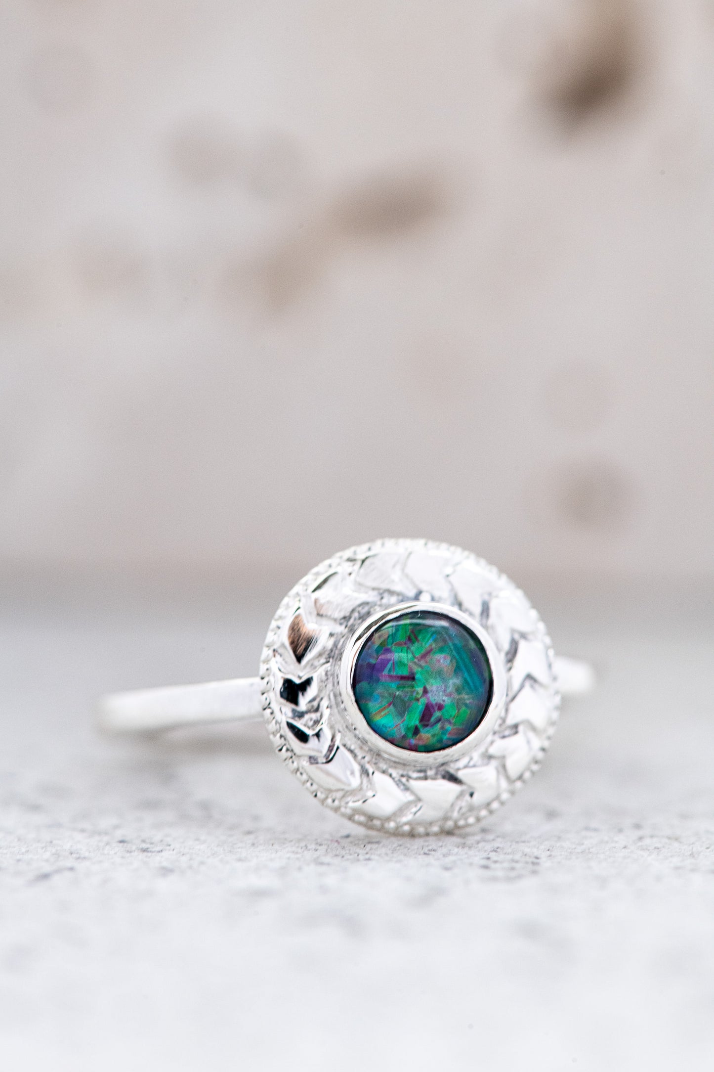 A handmade Australian Fire Opal Ring in 925 Sterling Silver with a green opal stone from Cassin Jewelry.
