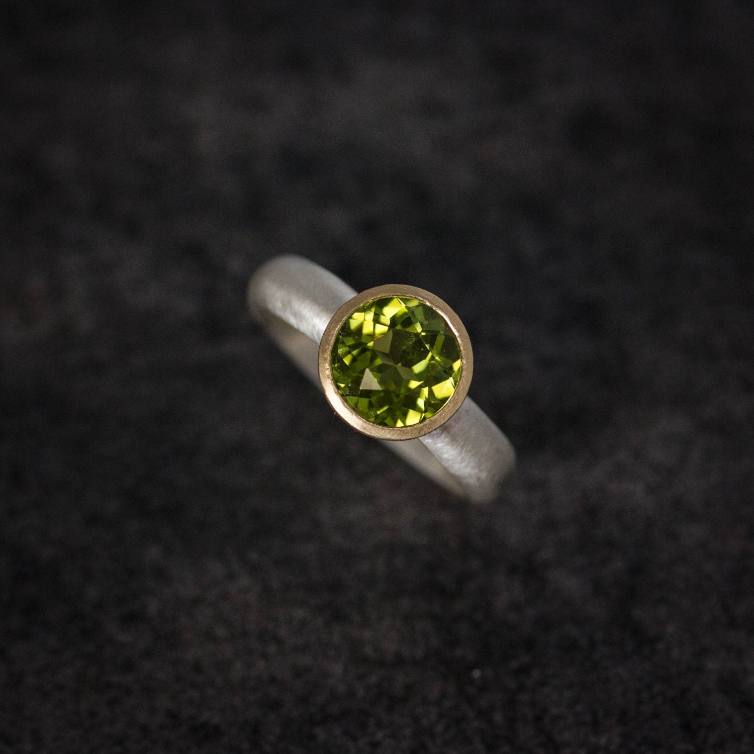 A Handmade Peridot Gemstone Ring with Cassin Jewelry.
