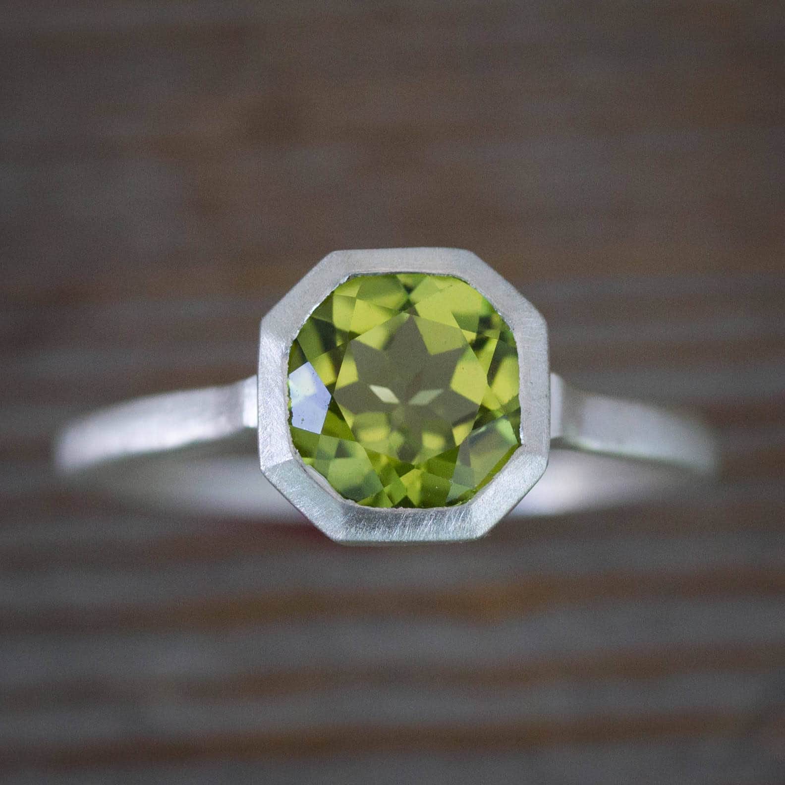 A handmade Peridot Ring in August Birthstone in sterling silver by Cassin Jewelry.