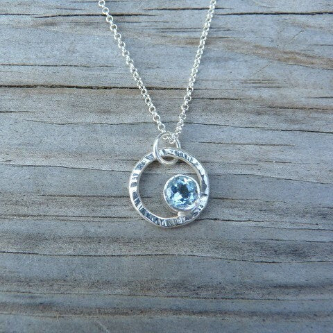 A handmade Shine On Necklace in Sky Blue Topaz and Sterling by Cassin Jewelry.