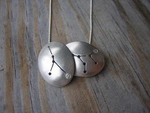 A handmade silver Cancer Constellation Necklace.