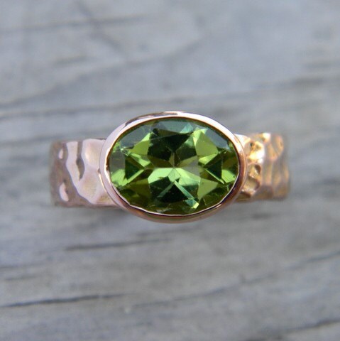 A handmade Peridot Ring in Rose Gold with a green peridot, by Cassin Jewelry.