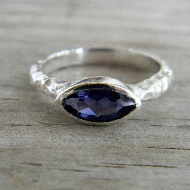 A Cassin handmade Iolite Slice Ring in Hammered Argentium Silver with a sapphire stone.