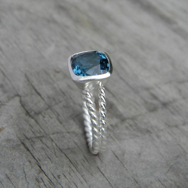 Handmade Silver London Blue Topaz Split Shank Ring with a blue topaz stone from Cassin Jewelry.