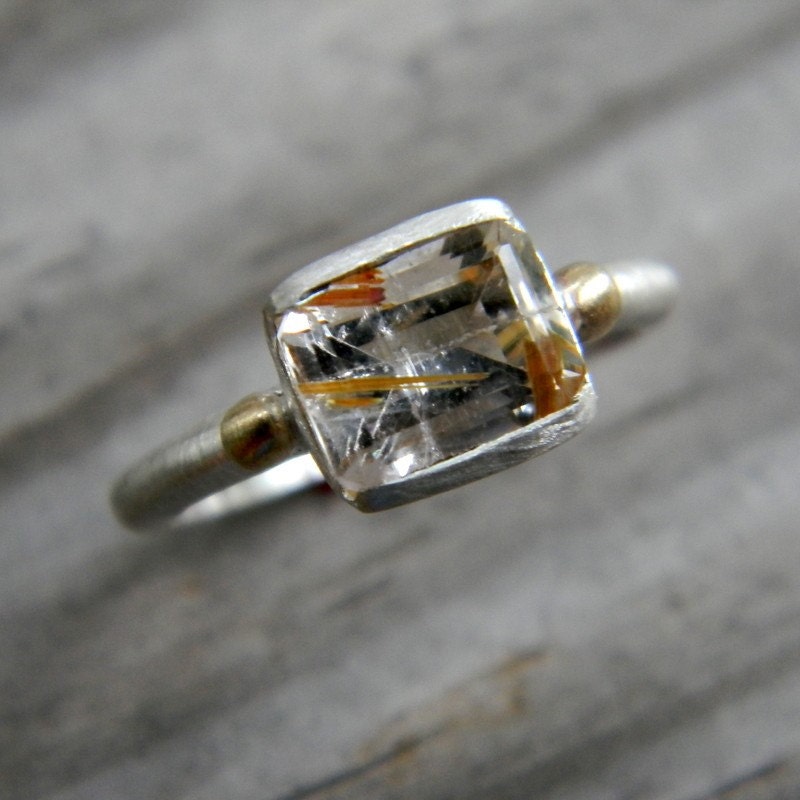 A handmade silver Emerald Cut Rutilated Quartz Ring in Mixed Metal by Cassin Jewelry.