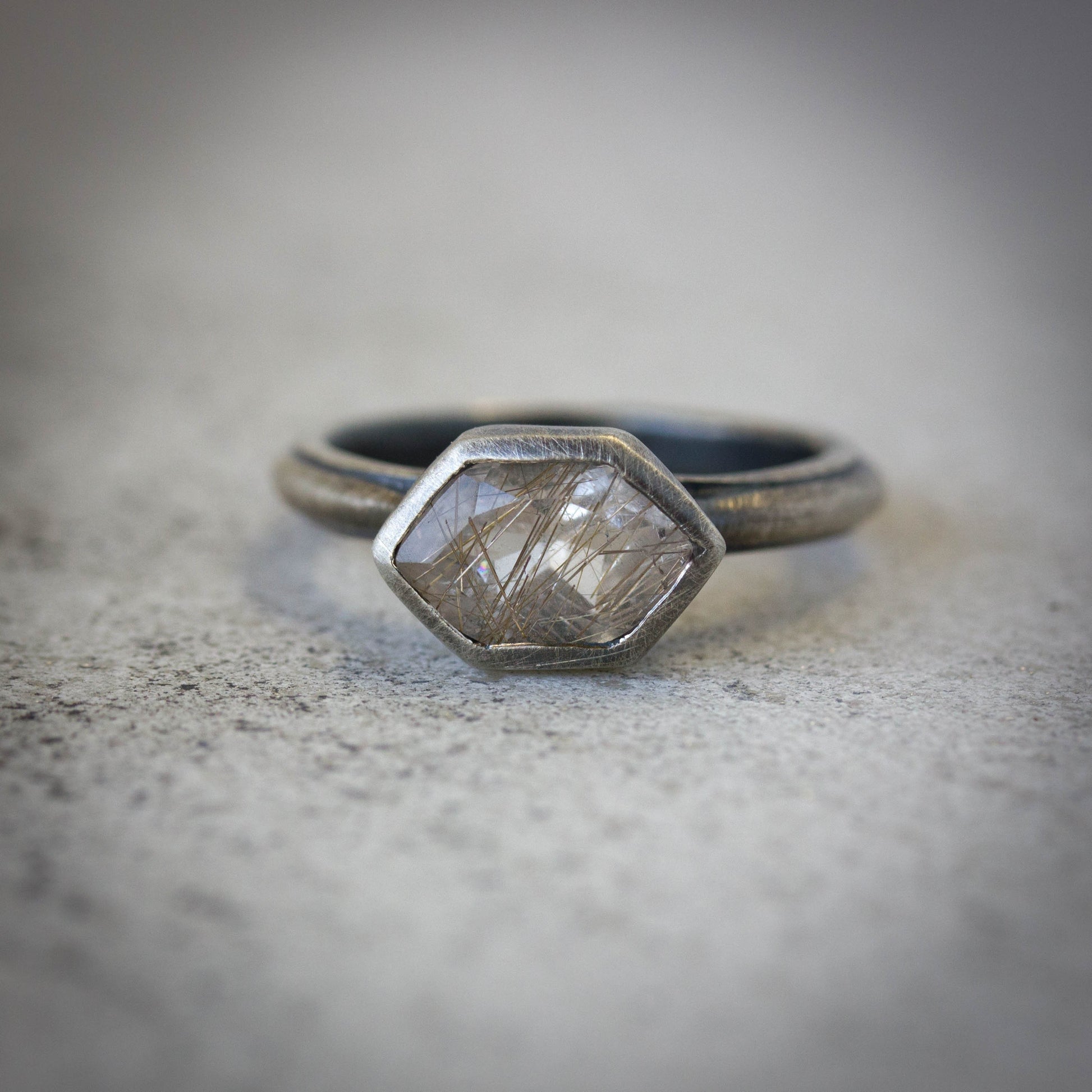 A handmade Rutilated Quartz Statement Ring with Antique Brushed Finish with a hexagonal shape.