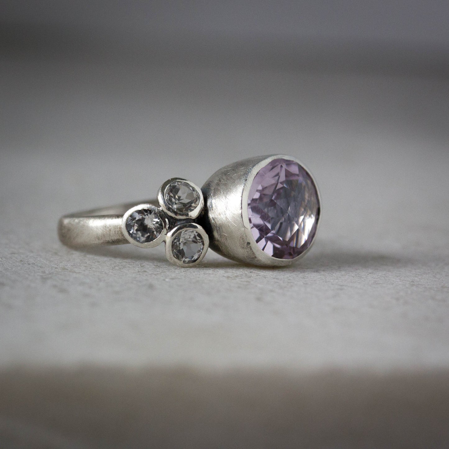 Handmade Cassin Jewelry featuring a Rose De France Amethyst and diamond ring.