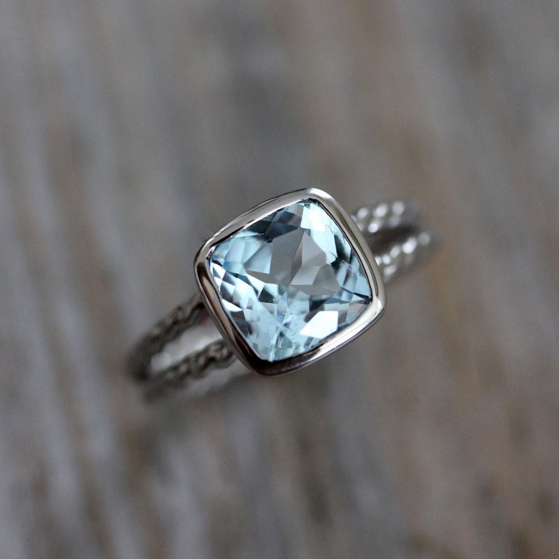 A handmade Sky Blue Topaz Ring with a blue topaz stone from Cassin Jewelry.