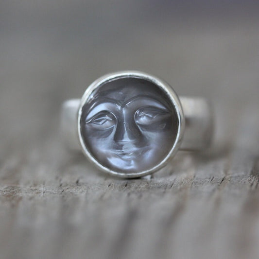A Cassin handmade Moonstone Face Ring with a moon face on it.