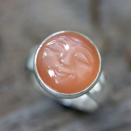 Handmade Peach Moonstone Ring with a face on it.