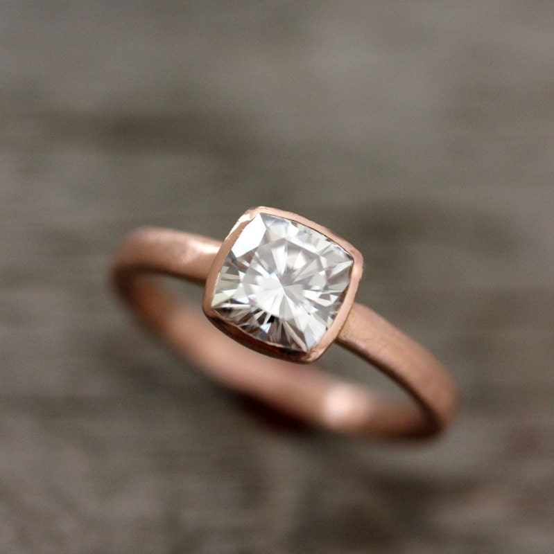 A Handmade Cushion Cut Rose Gold Engagement Ring designed with a cushion cut diamond by Cassin Jewelry.