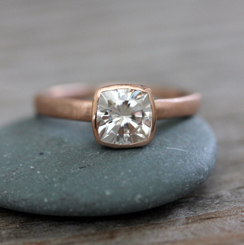 A handmade Cushion Cut Rose Gold Engagement Ring.