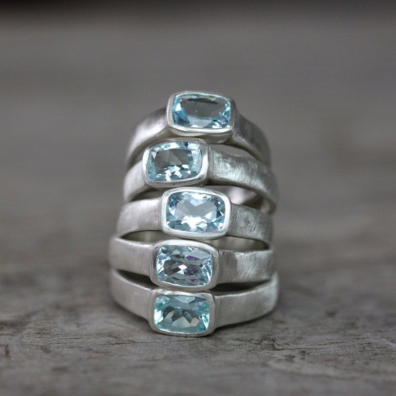 Handmade aquamarine and blue topaz rings by Cassin Jewelry.
