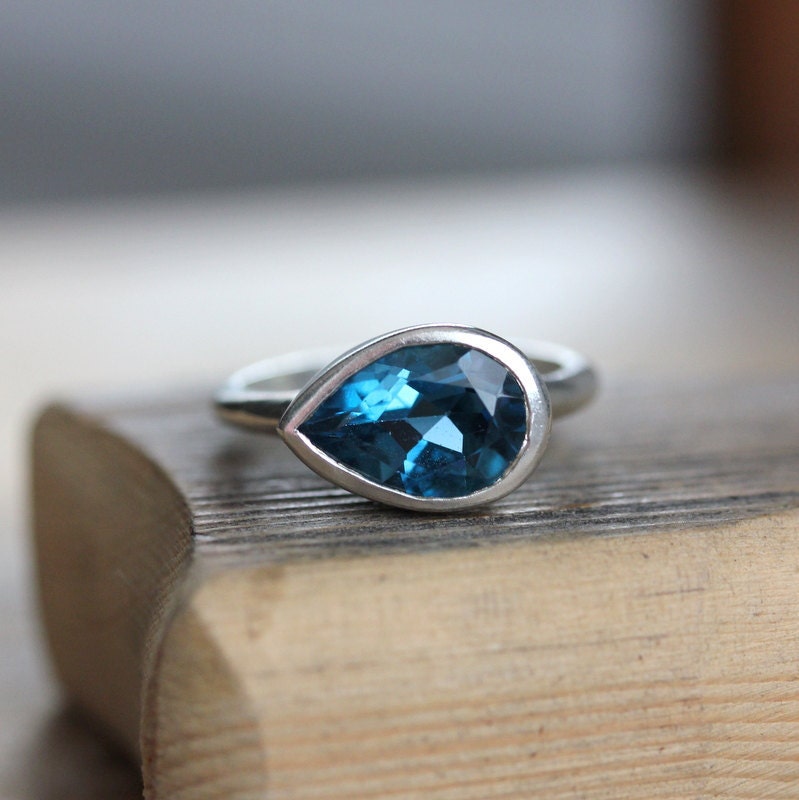 Handmade Large London Blue Topaz Sideswept Ring in sterling silver by Cassin Jewelry.