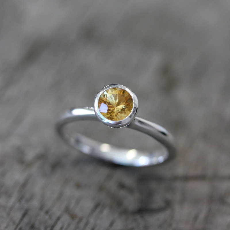 A handmade sterling silver round citrine ring.