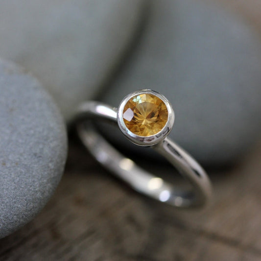 A handmade Round Citrine Ring with sterling silver and a citrine stone.