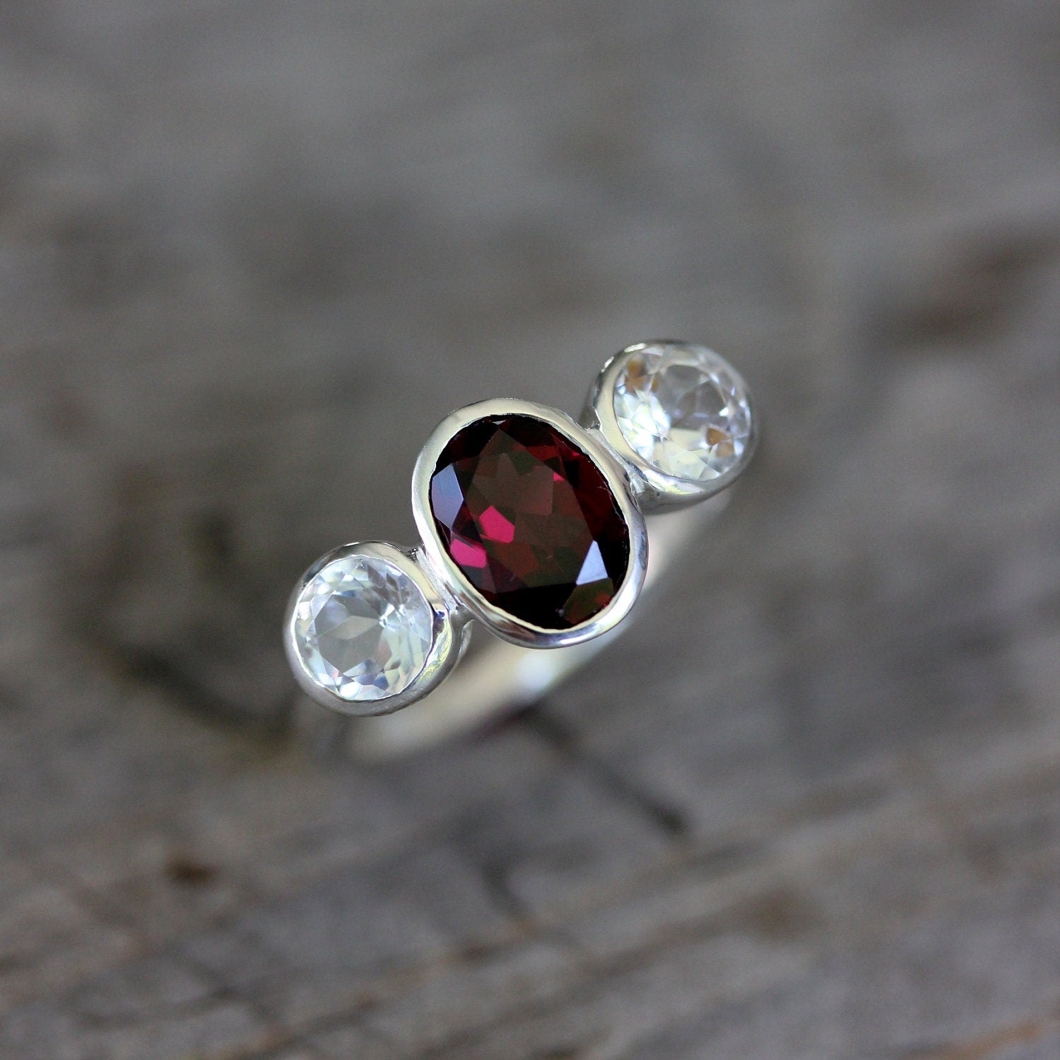 A Handmade Pink Garnet Ring with white diamonds by Cassin Jewelry.
