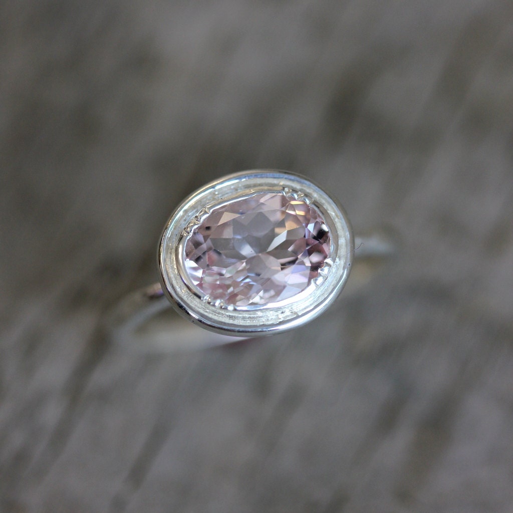 A Handmade Oval Morganite Ring with Halo Design.