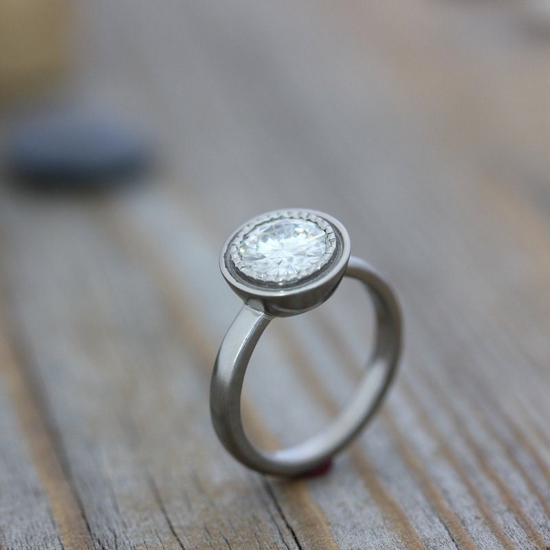 Handmade white gold engagement ring with a Round Forever One Moissanite.