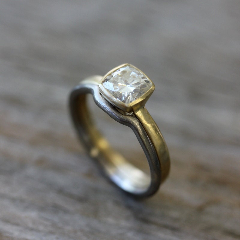 A handmade Moissanite Engagement Ring and Wedding Band Set with a cushion cut diamond.