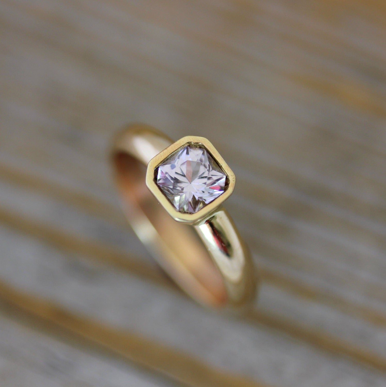 A handmade yellow gold Asscher Cut Pink Spinel Ring in 14k Yellow Gold engagement ring by Cassin Jewelry.