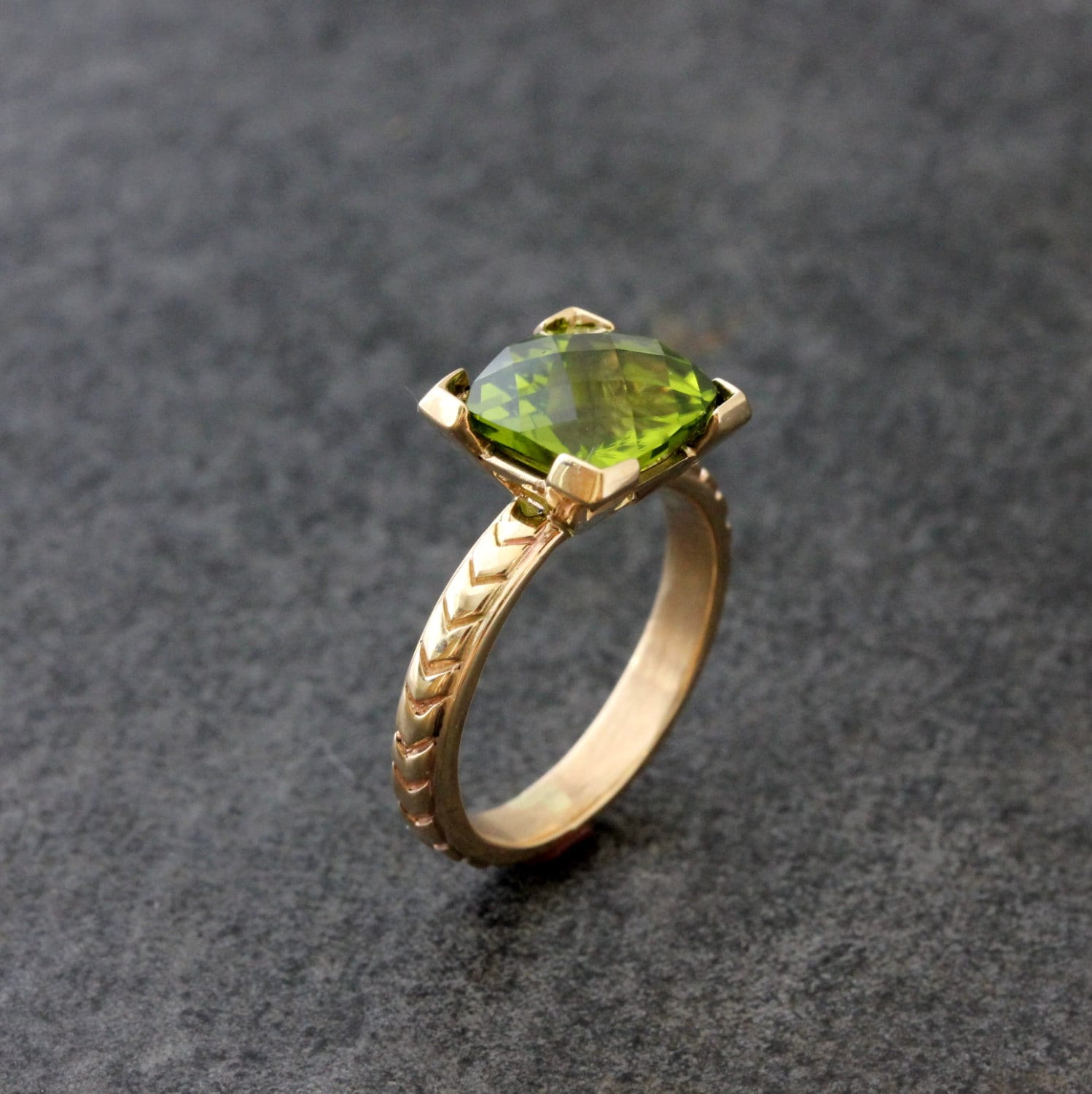 A Handmade Cushion Cut Peridot Yellow Gold Ring by Cassin Jewelry.
