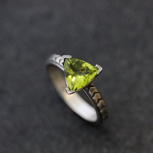 A Handmade Peridot Gemstone Ring in Sterling Silver with a peridot stone by Cassin Jewelry.