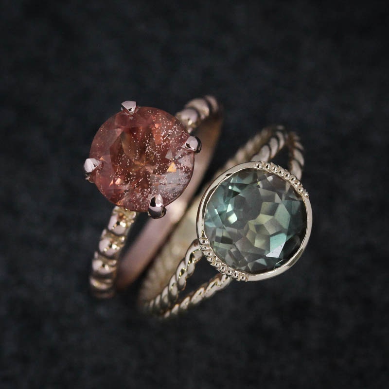 Handmade Oregon Sunstone Rings in Rose Gold with two different colored stones by Cassin Jewelry.