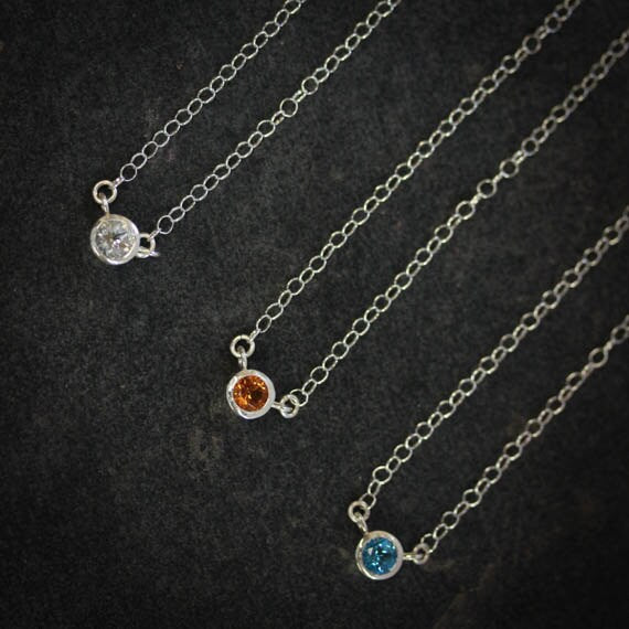 Three Handmade Citrine and Sterling Tinsel Necklaces with blue and orange stones by Cassin Jewelry.