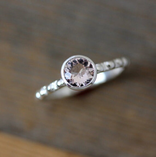 A Morganite Ring in Sterling Silver with a morganite stone on top, handmade by Cassin Jewelry.